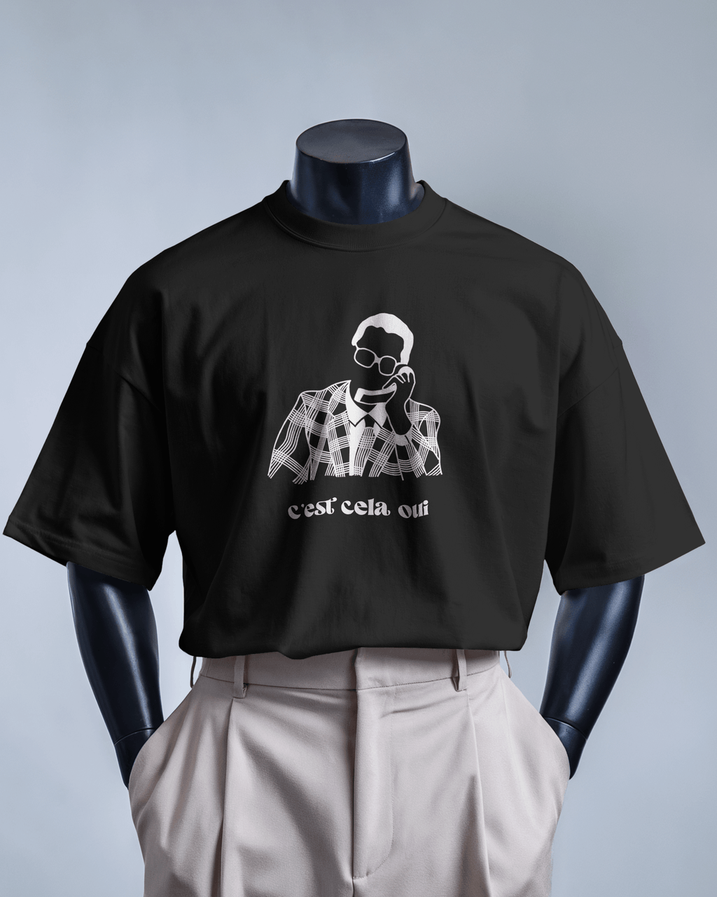T-shirt blanc MerciSidi avec texte "C'est cela oui... Le père Noël est une ordure" affiché sur le devant.