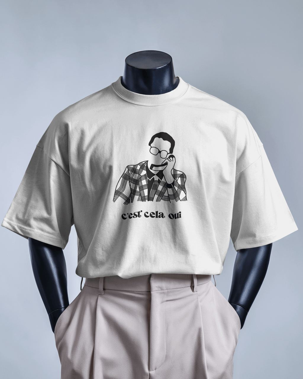 T-shirt blanc MerciSidi "C'est cela oui... Le père Noël est une ordure" avec impression graphique humoristique.