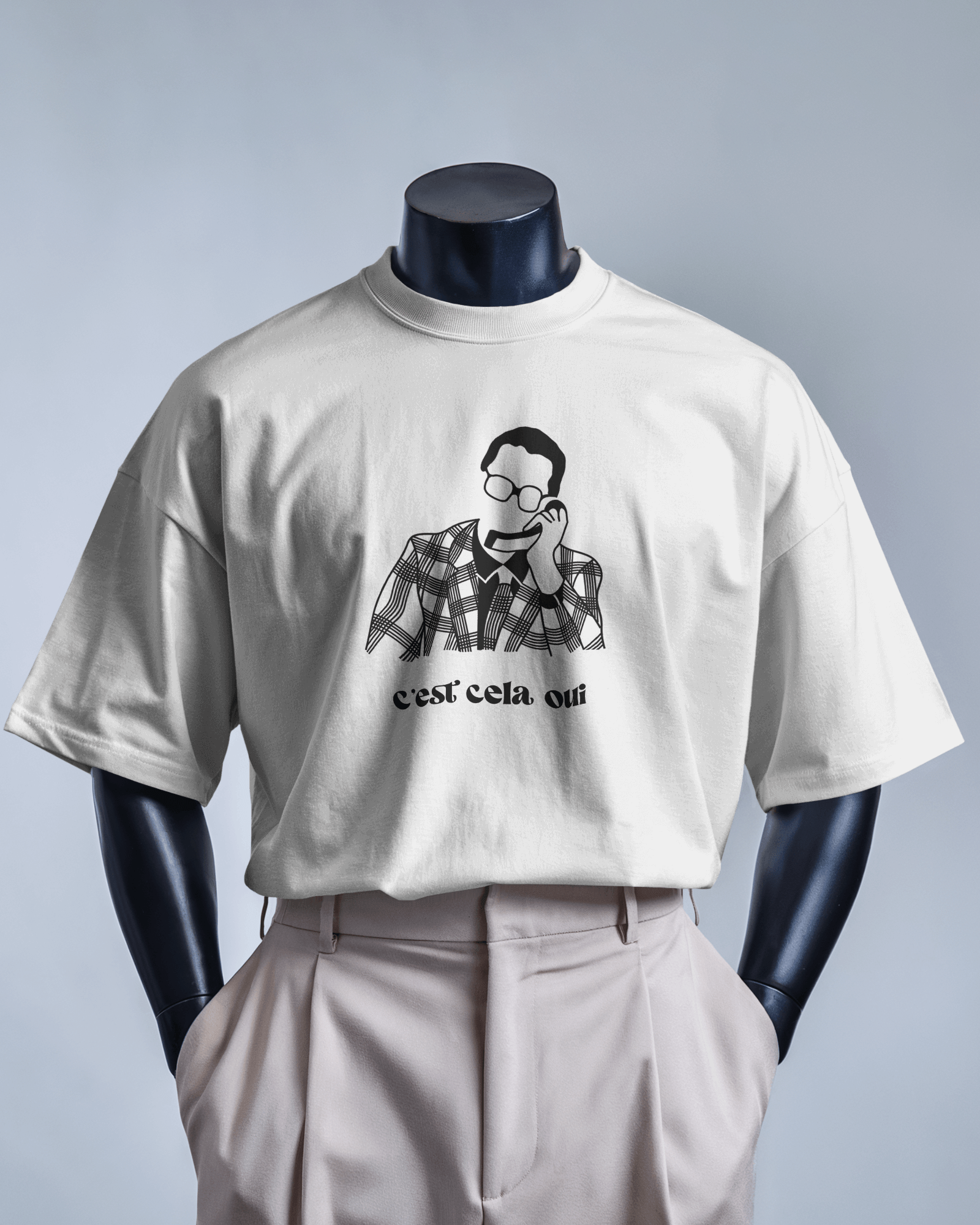 White MerciSidi T-shirt featuring "Le père Noël est une ordure" graphic design.