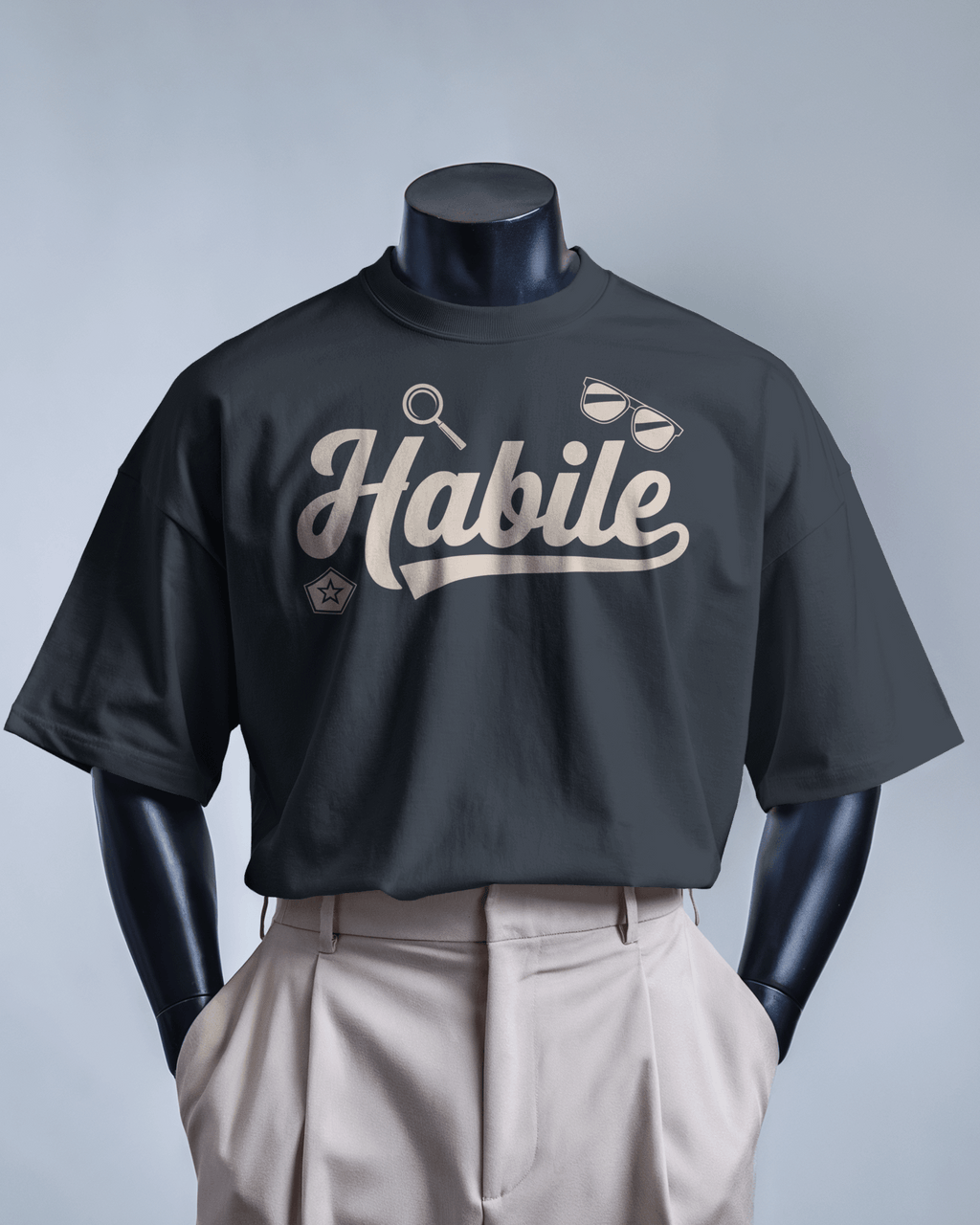 T-shirt noir Habile MerciSidi avec logo OSS 117, design décontracté et moderne, en coton confortable pour homme.